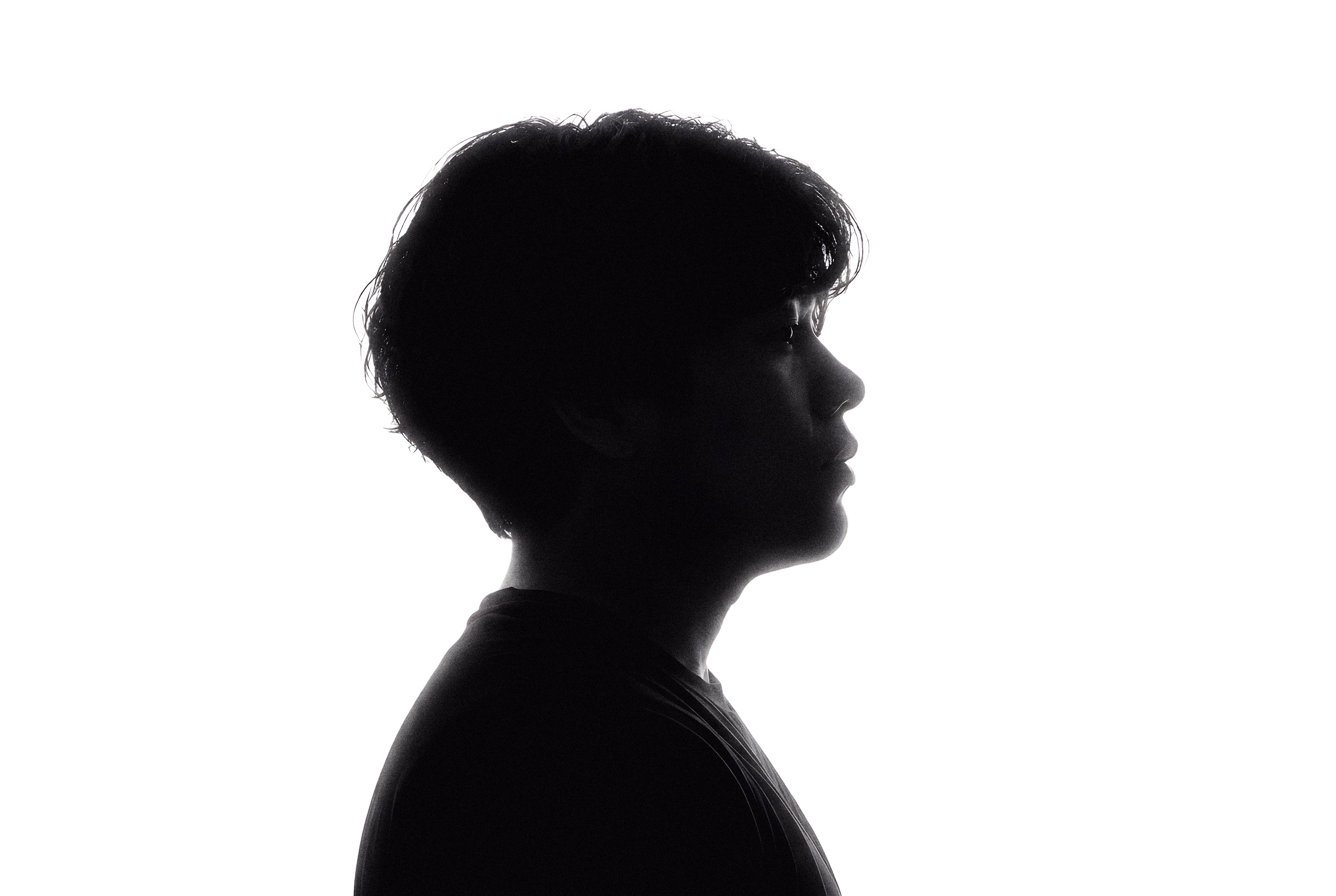 Larry Li in profile, backlit silhouette