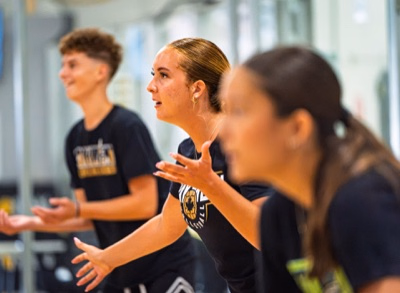 Volleyball team practising a passing drill
